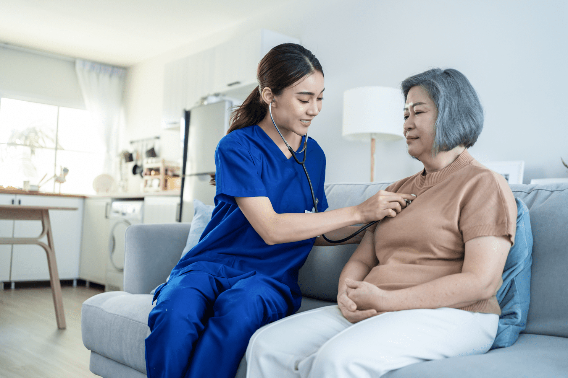 Asian beautiful nurse at nursing home take care senior elderly woman.